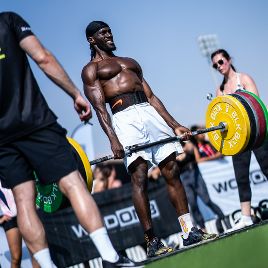 man using BLK BOX weight plates