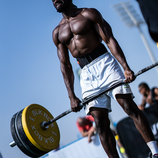 man using BLK BOX weight plates